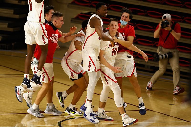 Azuolas Tubelis #10 of the Arizona Wildcats celebrates with teammates